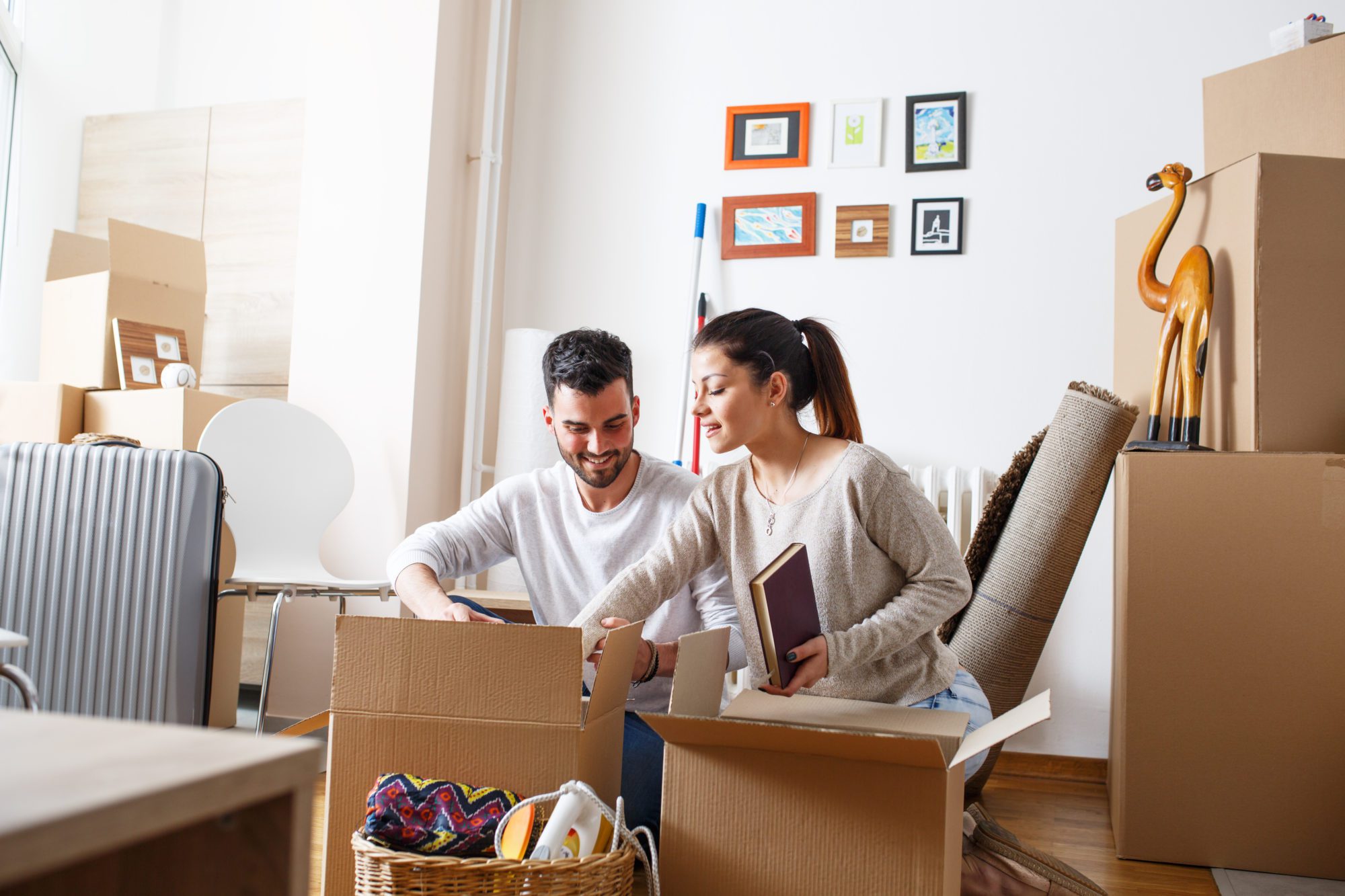 young couple unpacking