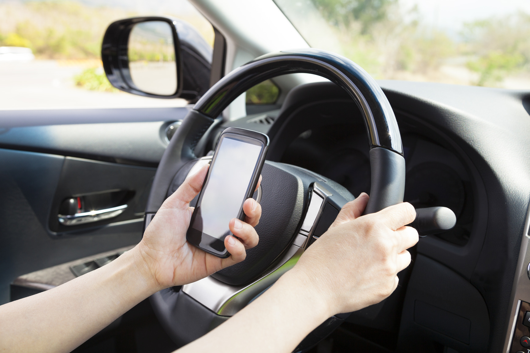 Why You Need To Talk To Your Kids About Distracted Driving