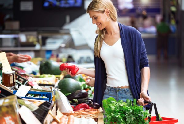 woman buying veggies
