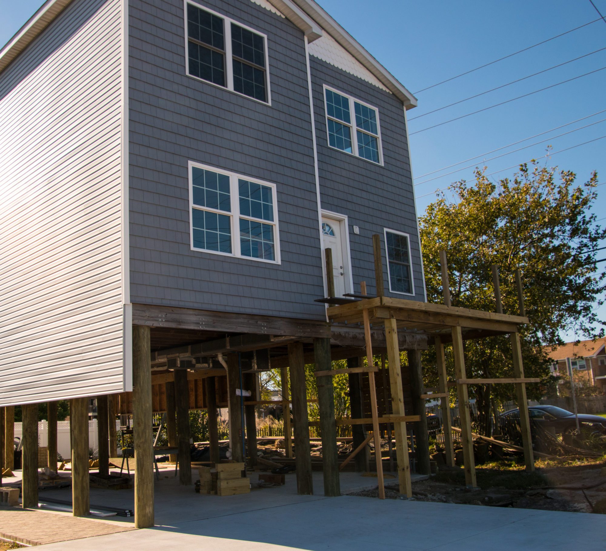 House being raised and put on stilts to avoid flooding